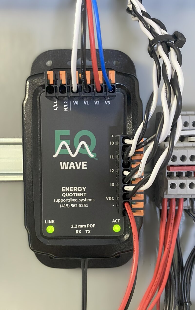 EQ Wave sensor installed in electrical panel with voltage leads, current sensors, and POF fiber connected